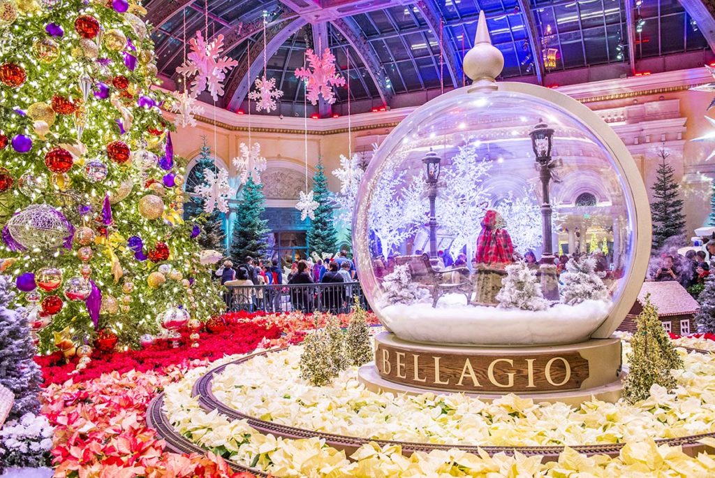 Winter Season in Bellagio Hotel Conservatory & Botanical Gardens featuring a snowglobe and Christmas decorations