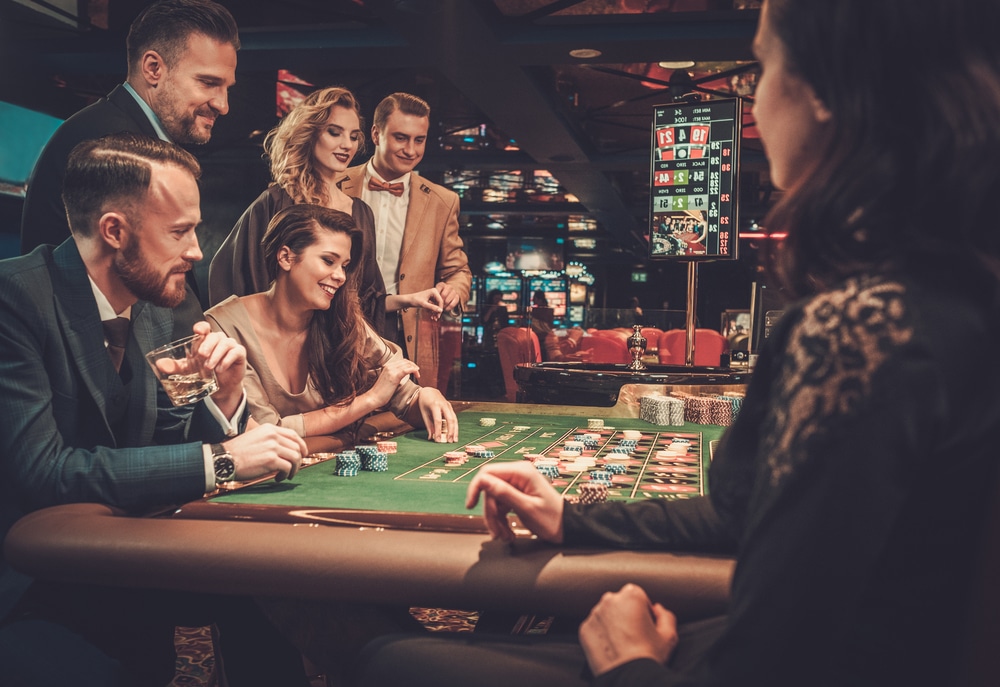 Image of well-dressed people gambling in a casino