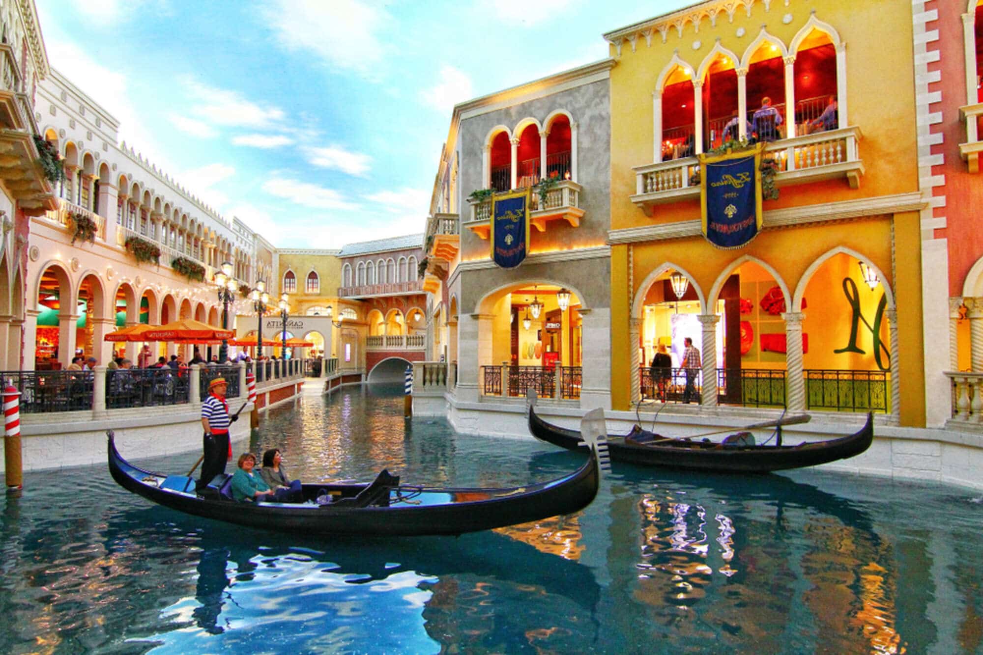 Image of a gondolier taking tourists through the canals in the Grand Canal Shoppes