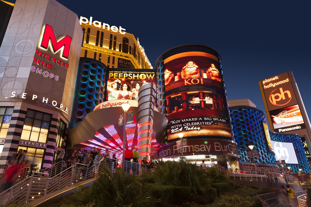 Image of Planet Hollywood and the Miracle Mile shops at night circa 2013