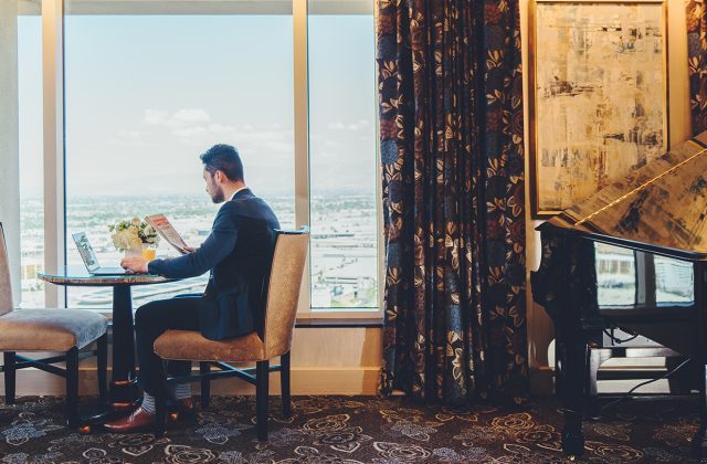 Image of a man sitting at a table in the Prestige Club Lounge in The Venetian Resort Las Vegas