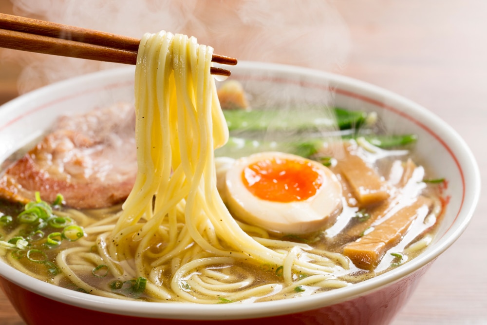 Image of ramen bowl with eggs and chopsticks 