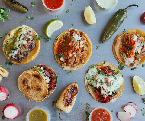 Image of tacos and vegetables on a table