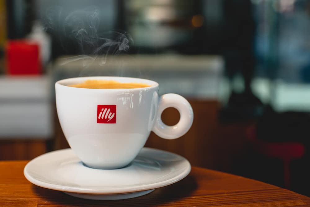 illy cup steaming on table