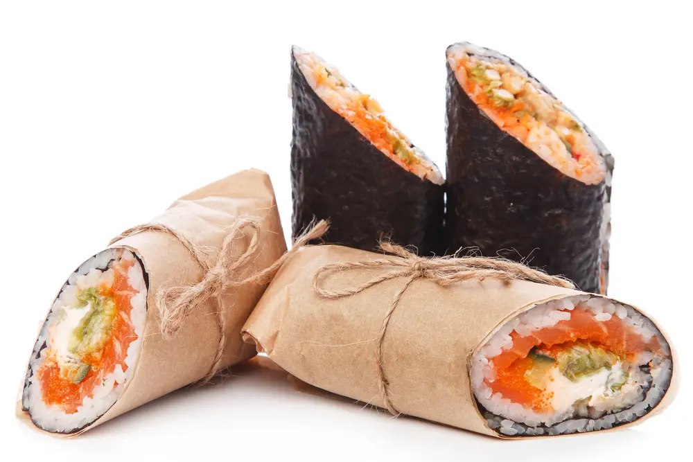 Sushi burritos wrapped in white paper