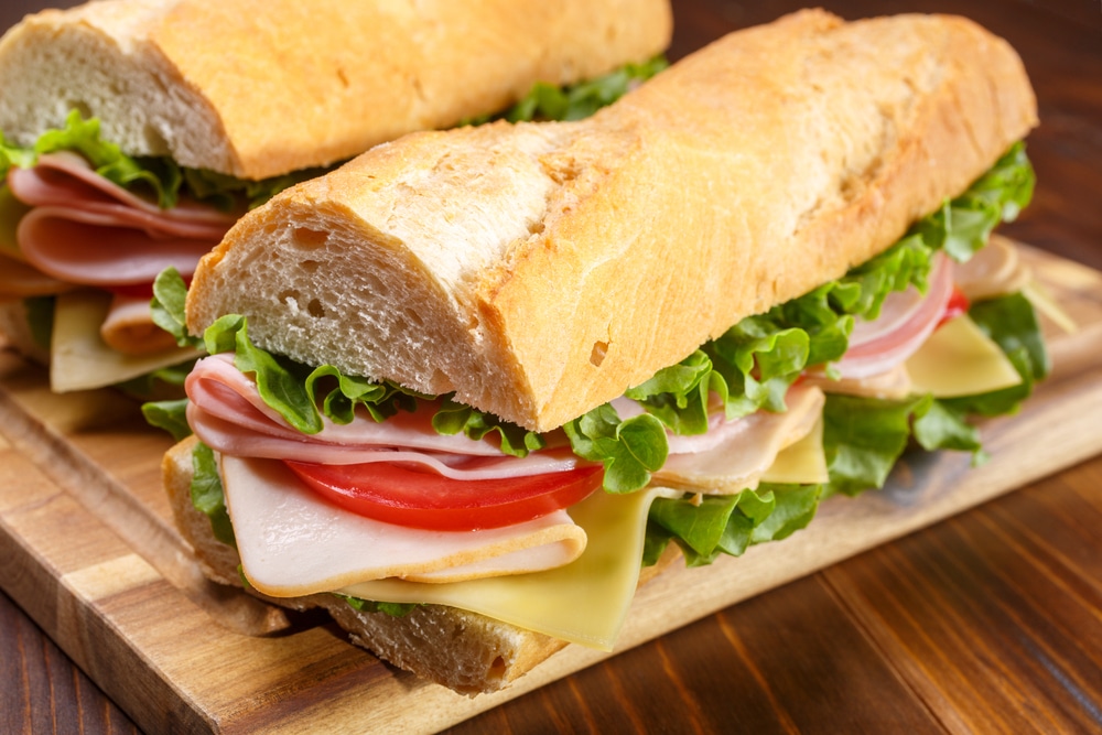 Image of ham, lettuce, and cheese baguette sandwich