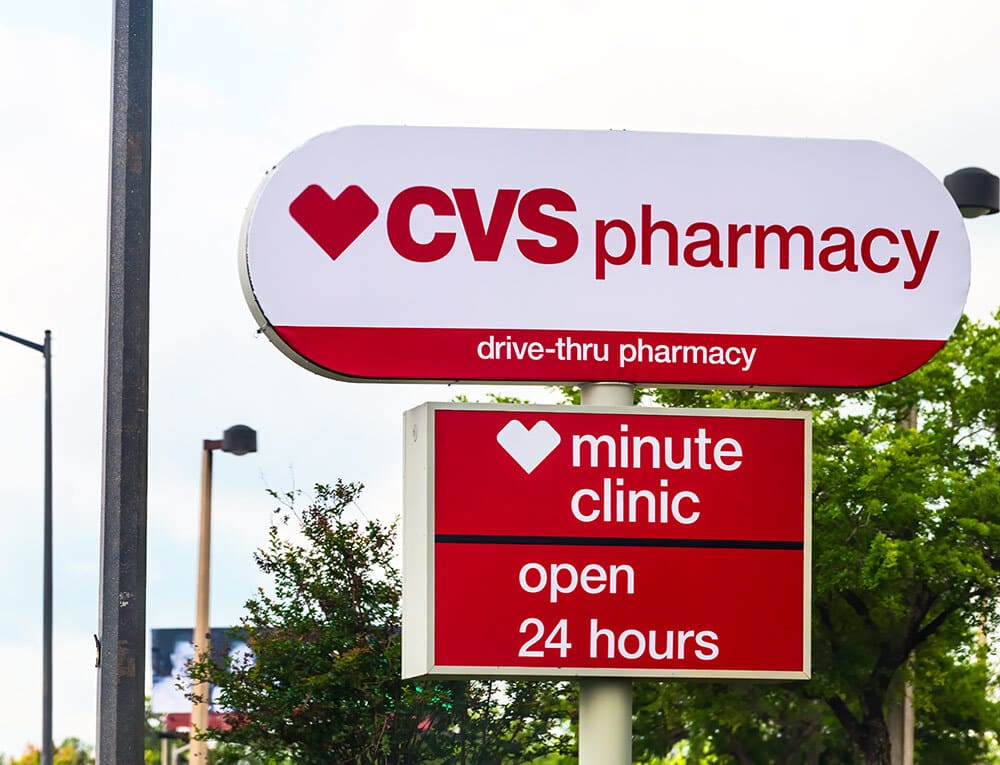 CVS Pharmacy sign with drive-thru pharmacy - Open 24 hours