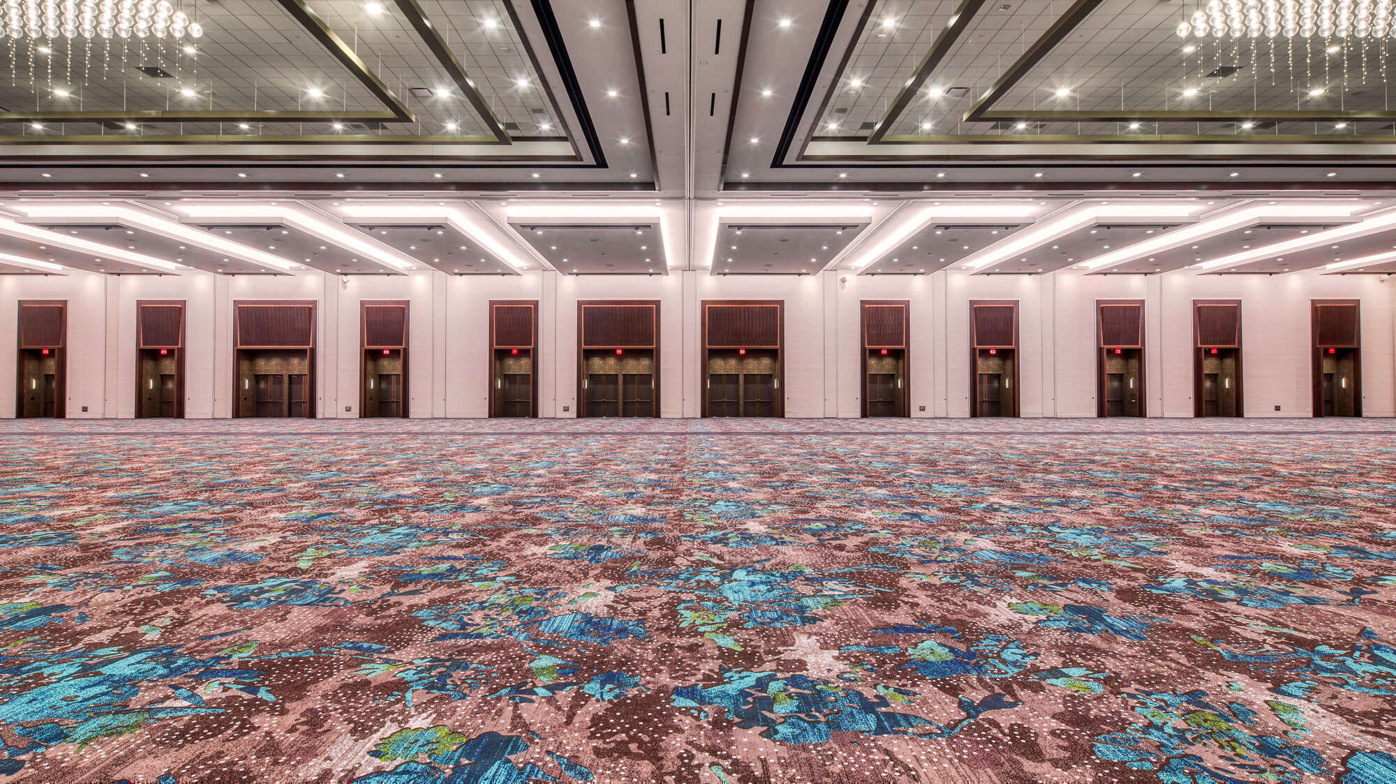 empty ballroom with pink flower carpet