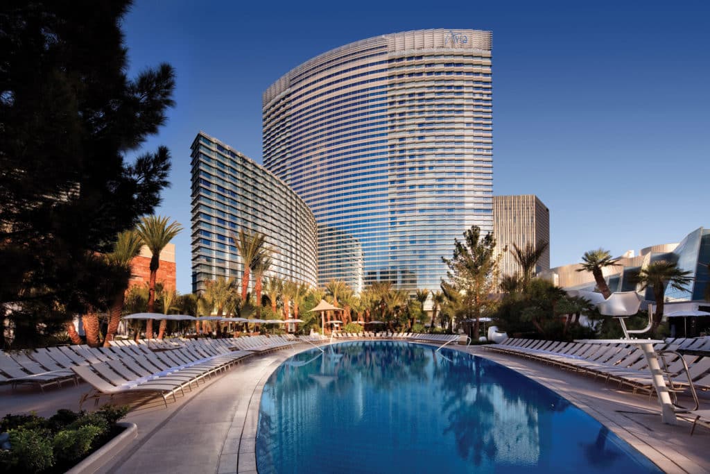 long oval-shaped pool at ARIA with towers in the background