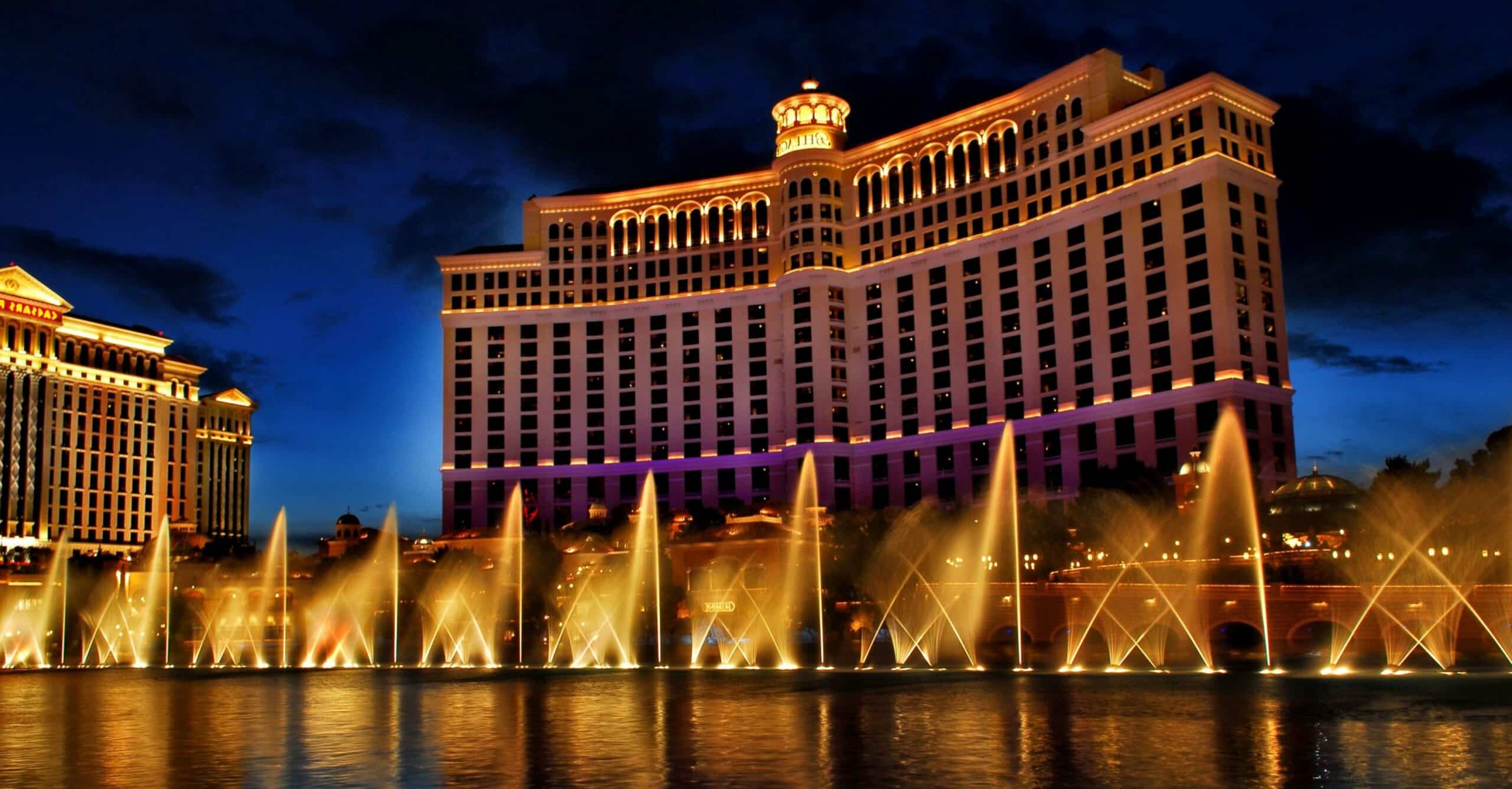 Bellagio Resort at night with gold fountain water