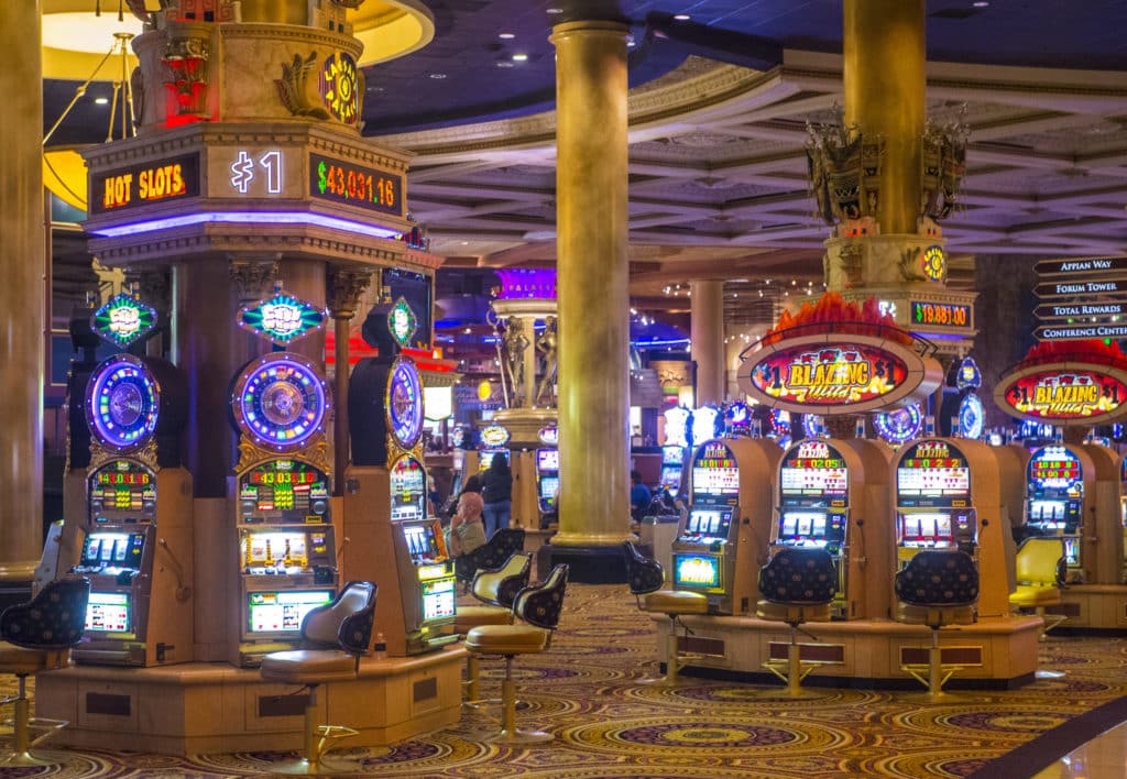 slot machines around columns of Caesars Palace casino