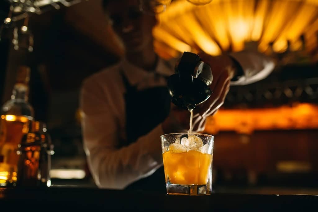 man mixing a cocktail