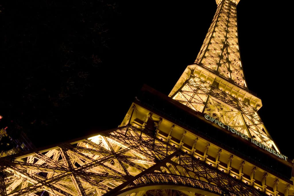 Upward perspective of the Eiffel Tower replica at Paris Las Vegas Hotel at night