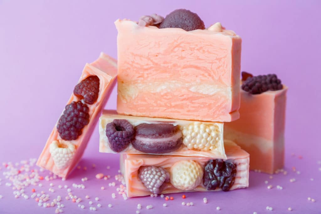 pink soap with berries and macarons