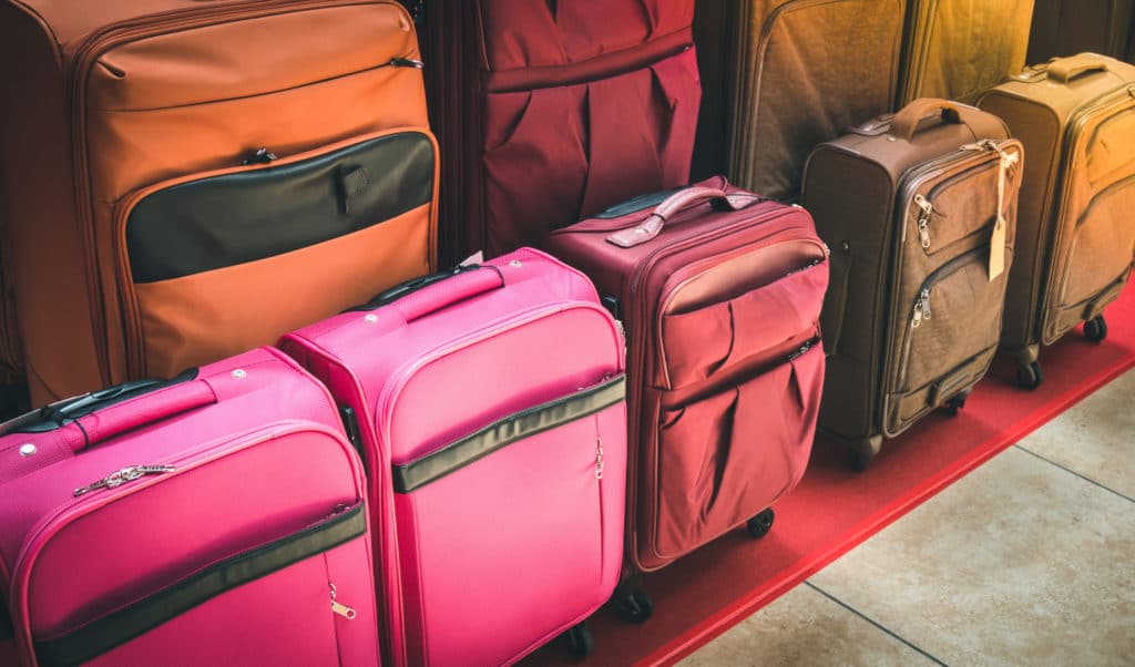 suitcases in various sizes and colors