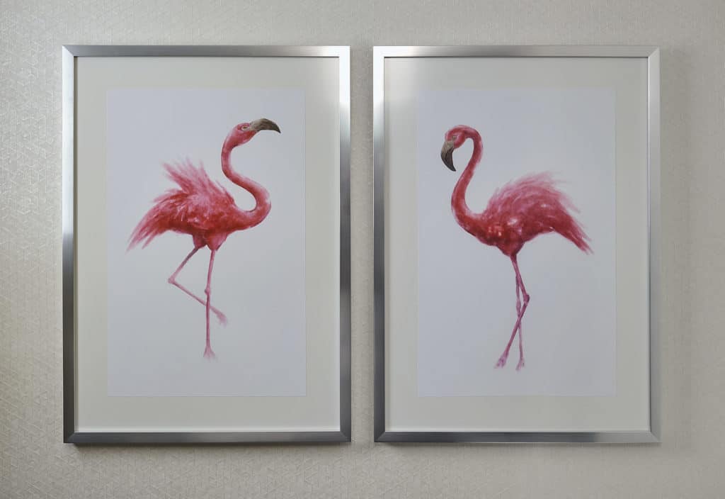 two flamingo picture frames