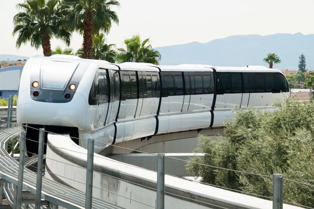 Las Vegas Monorail traveling against the backdrop of Las Vegas' skyline.