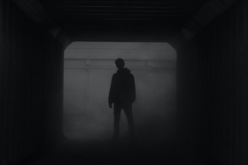 Silhouette of a boy in the smoke