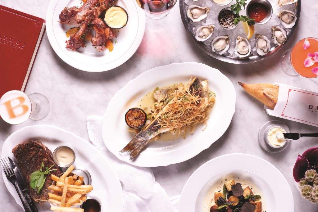 grilled fish and side dishes at BARDOT Brasserie