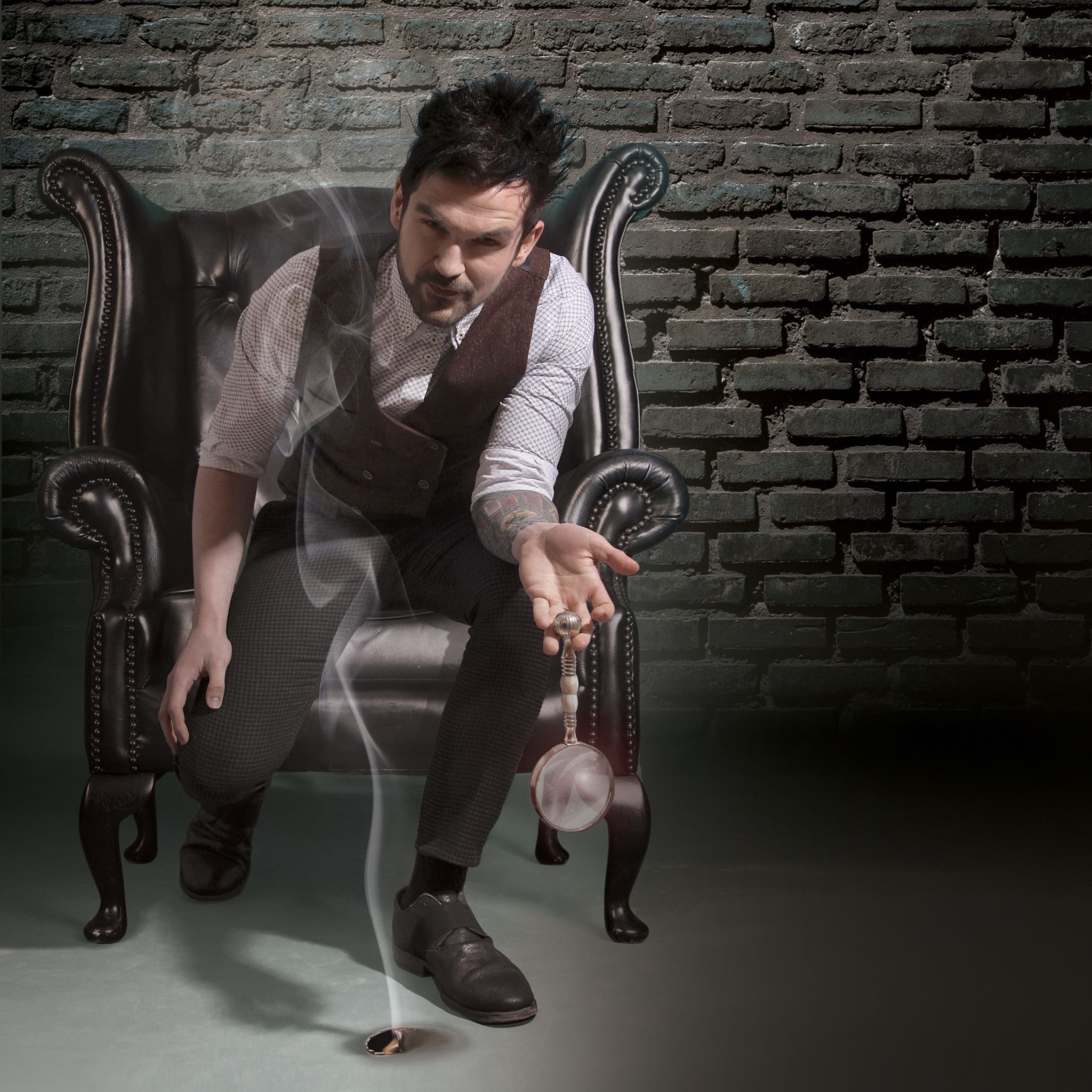 Colin Cloud sitting in a chair