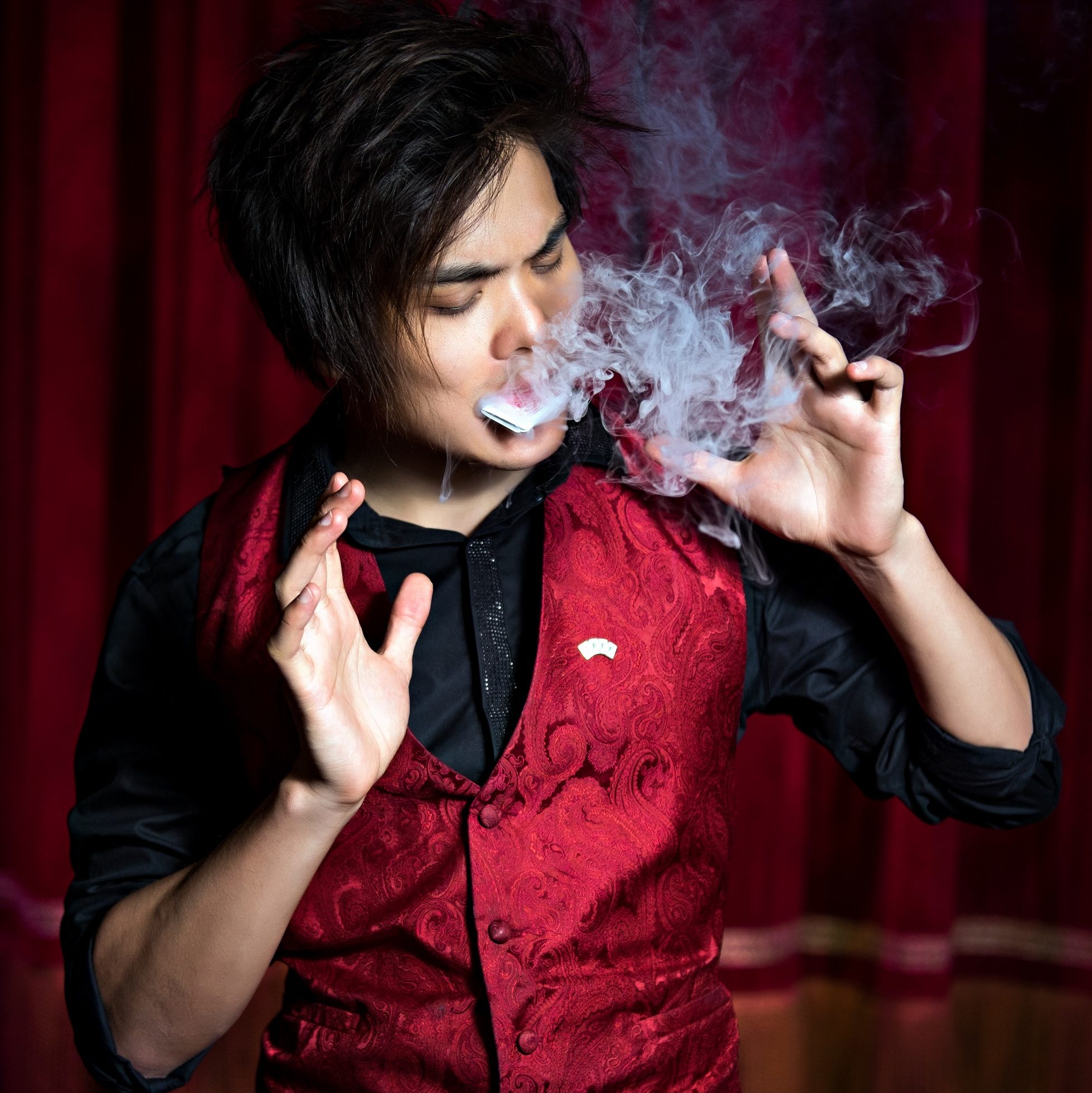 Shin Lim blowing smoke from cards