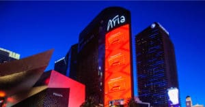outside view of the ARIA Casino and resort at dusk with red lights