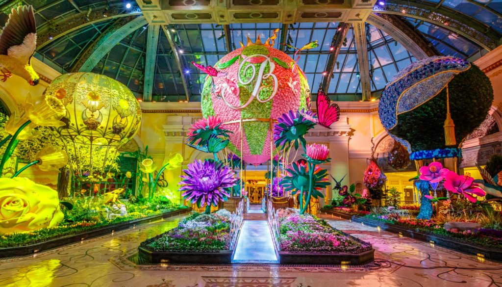 Bellagio botanical gardens with hot air balloons and flowers on them and a B on the center one