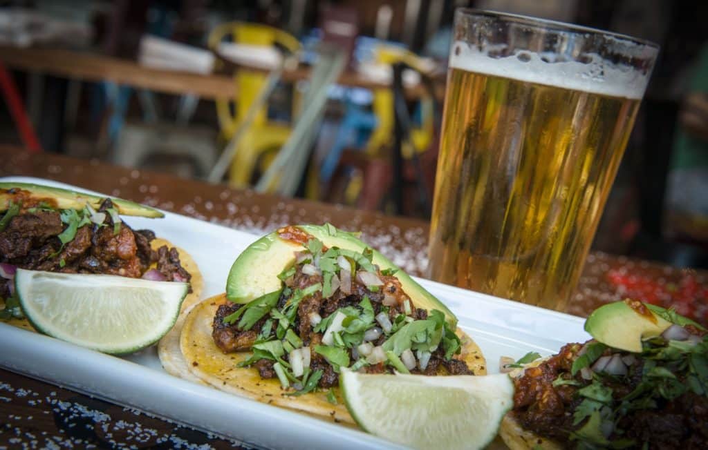 a table of tacos and beer at Cabo Wabo Cantina for Cinco de Mayo