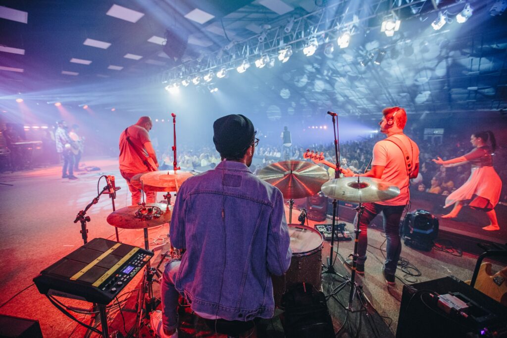 Image of a band playing music from the back of the stage