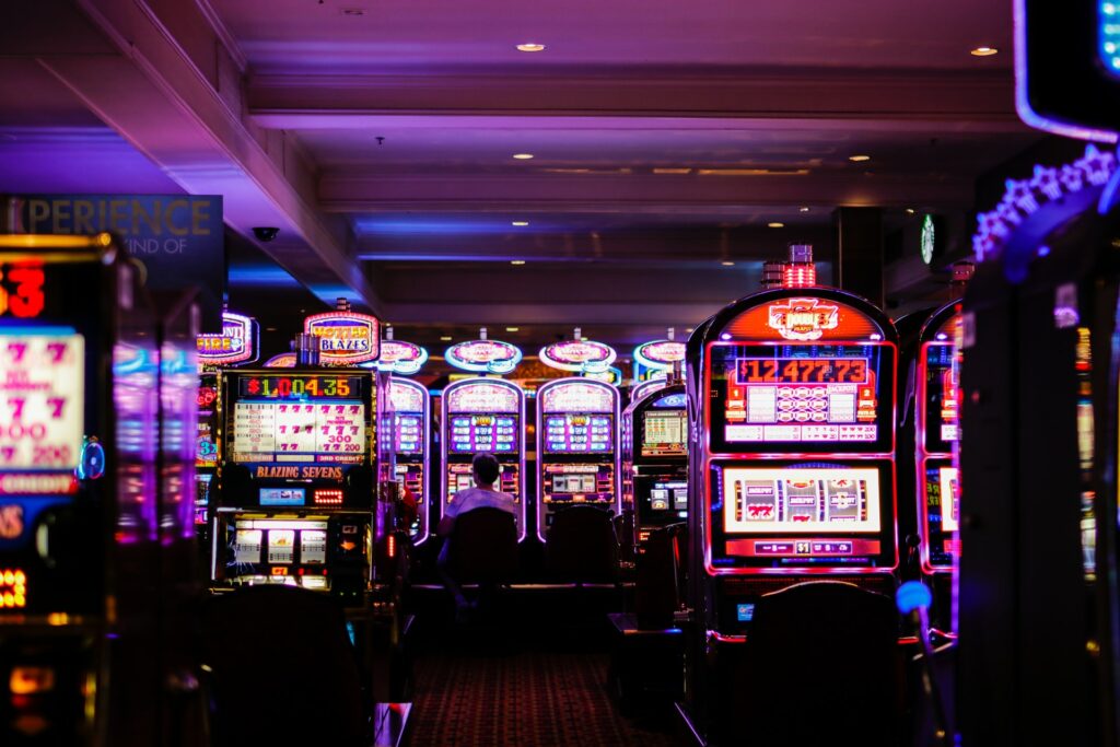 A dark casino floor in Las Vegas with slot machines