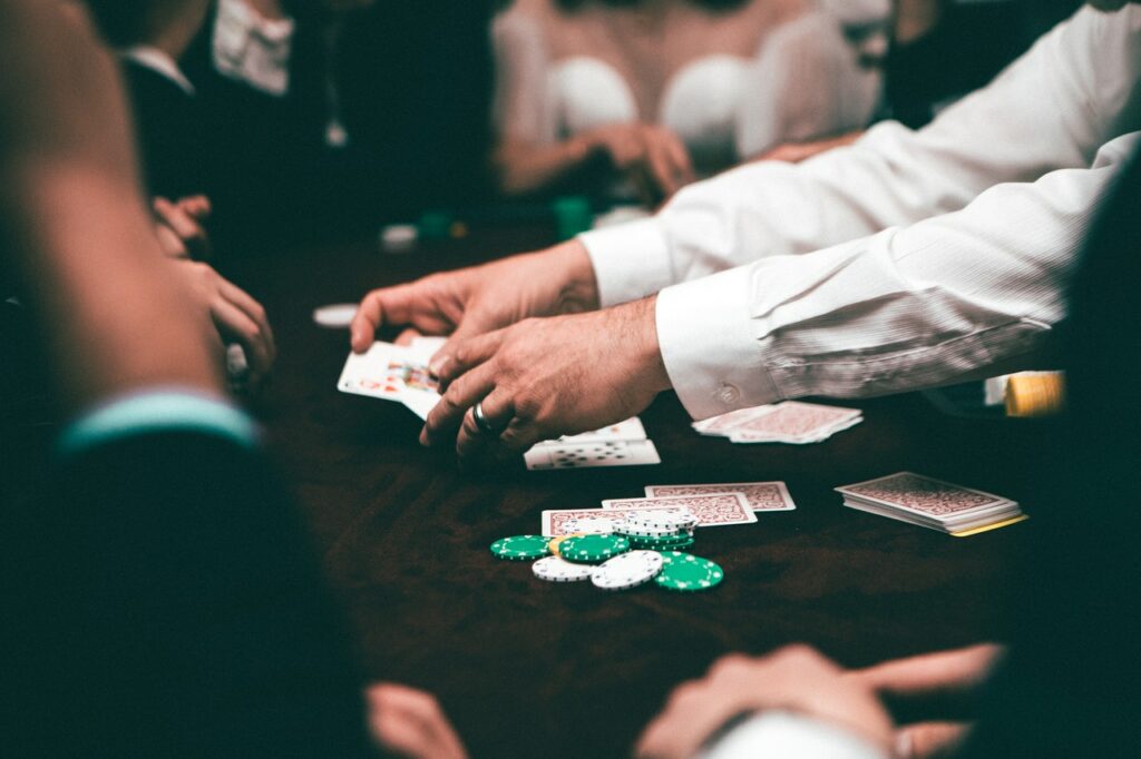 Close up of a croupier dealing poker