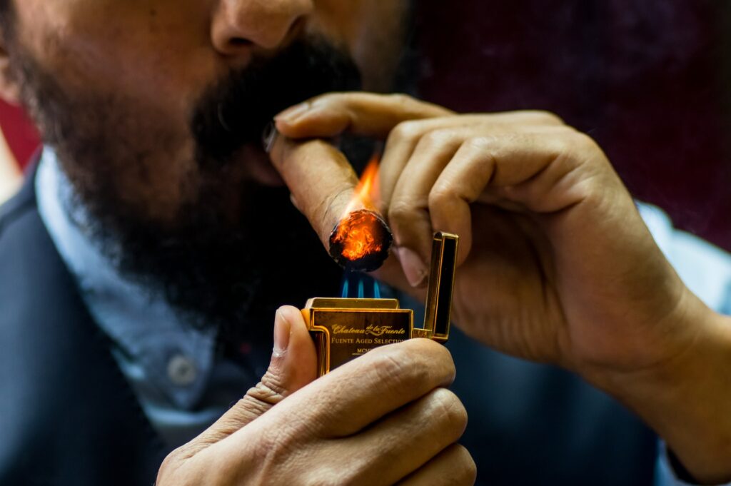 A man lighting a cigar in Las Vegas