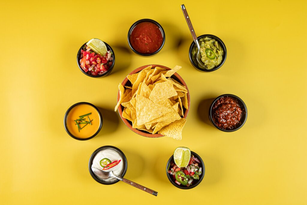 Tortilla chips with a selection of dips