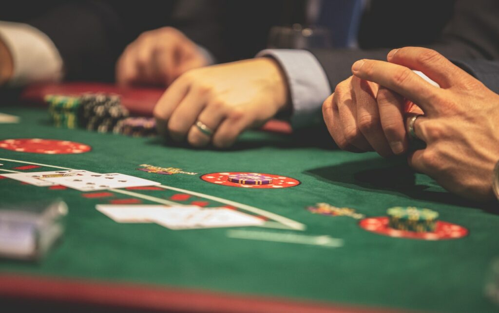A group of men play blackjack in Vegas