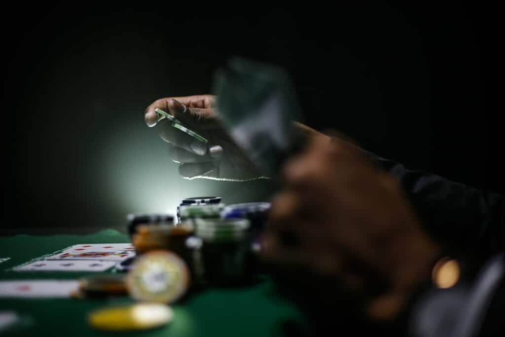 A man playing poker in the dark