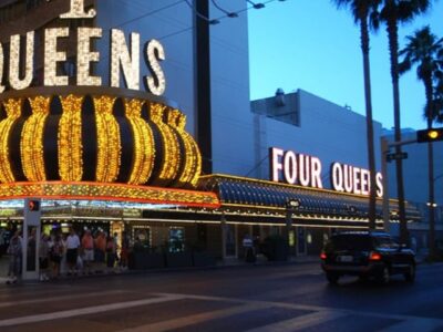Image of the Four Queens Hotel & Casino's exterior in dusk