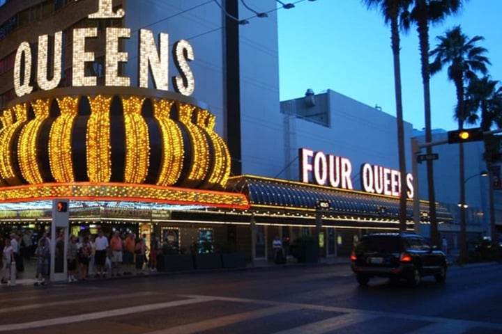 Image of the Four Queens Hotel & Casino's exterior in dusk