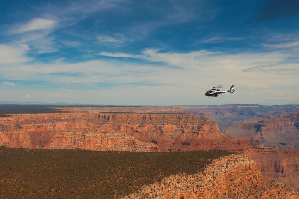 helicopter flying over the Grand Canyon