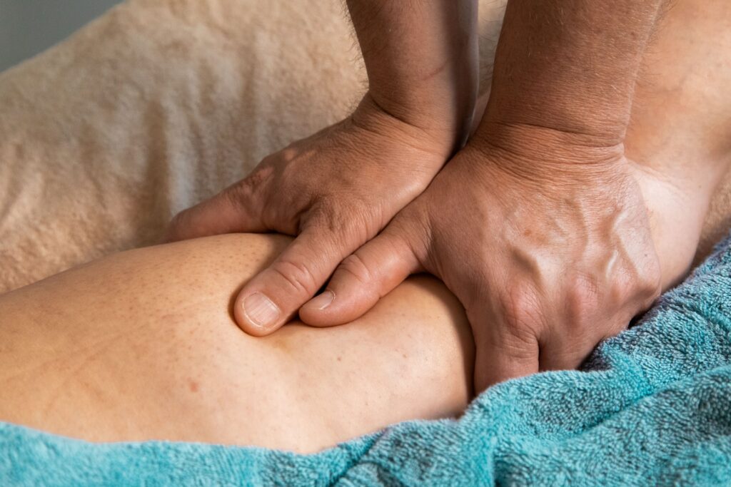 A man giving an arm massage
