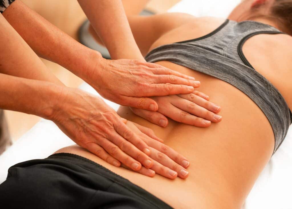 A woman receiving a double massage