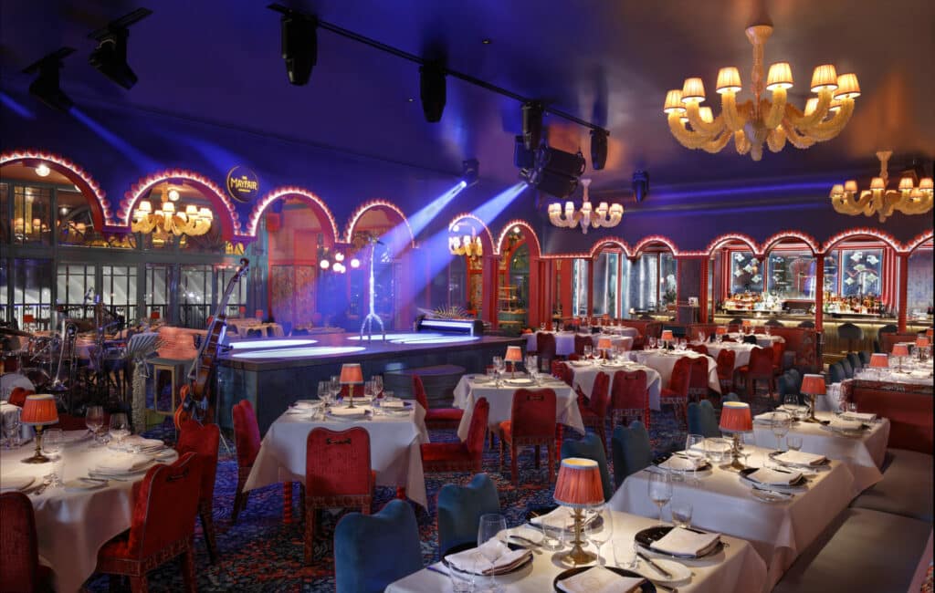 dining room tables and stage at Mayfair Supper Club