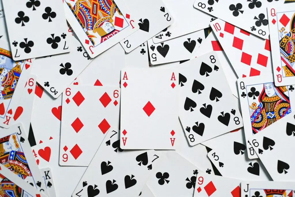 Image of a pack of cards spread out in a non-uniform manner.