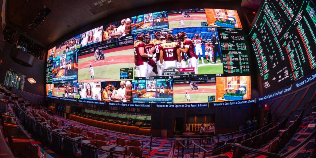 The sportsbook viewing area with large screens at Circa Hotel
