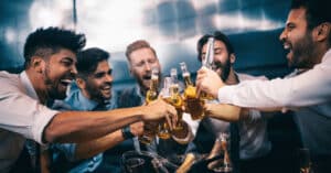 Men toasting beers to bachelor parties in Vegas