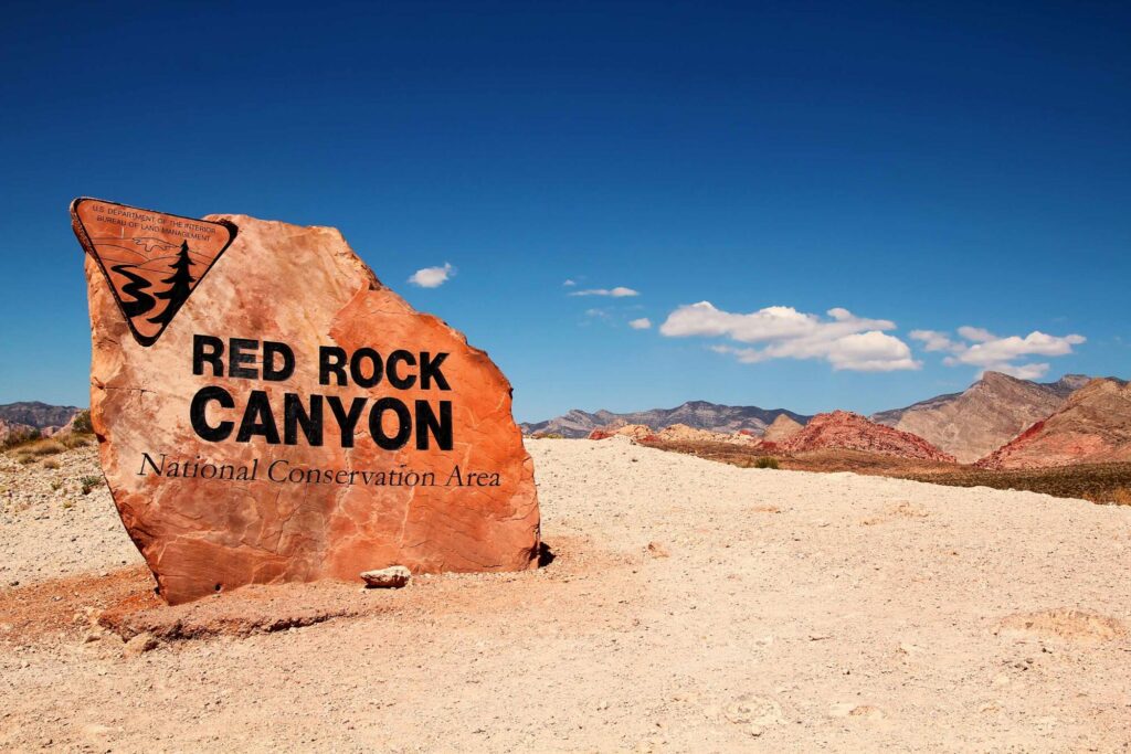 A large rock that announces the Red Rock Canyon National Conservation Area.
