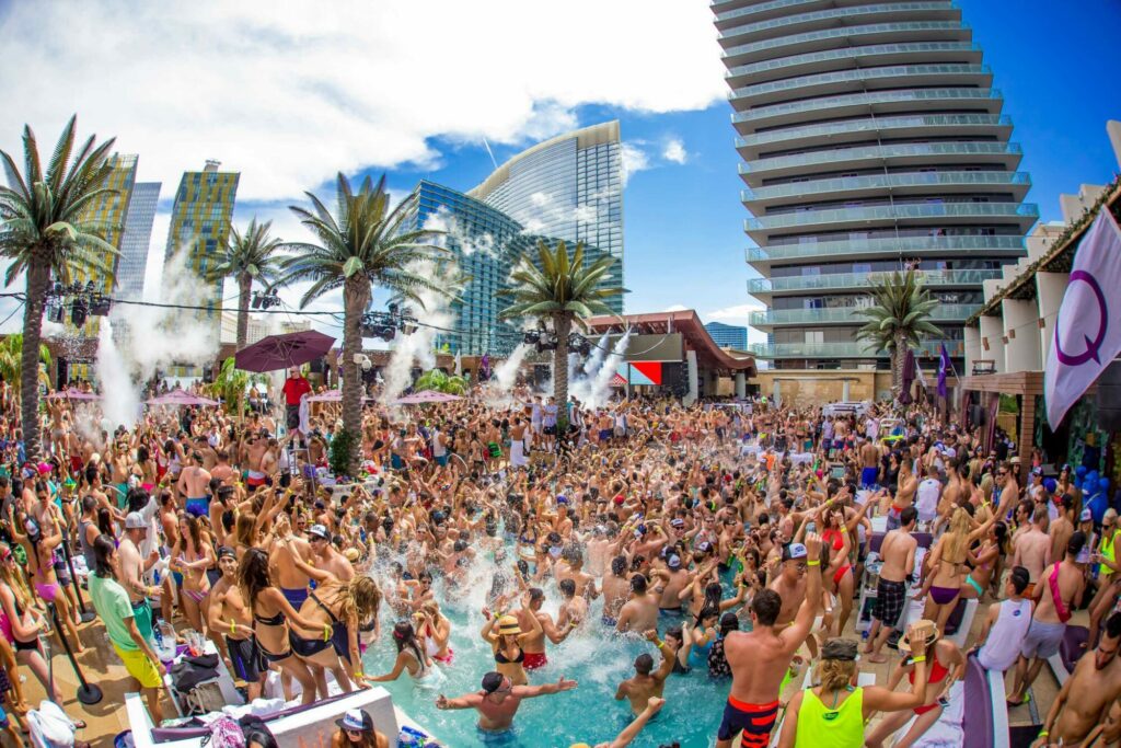 Hundreds of people partying in a pool at Marquee Dayclub