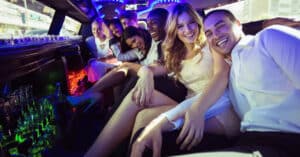 A group of friends having fun on a party bus.