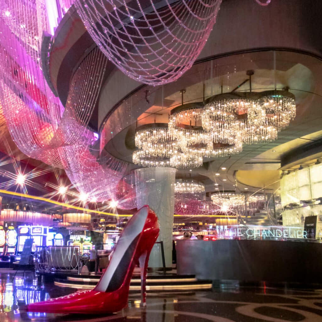 A giant red high heel shoe is displayed in the exquisite Chandelier Bar at the Cosmopolitan