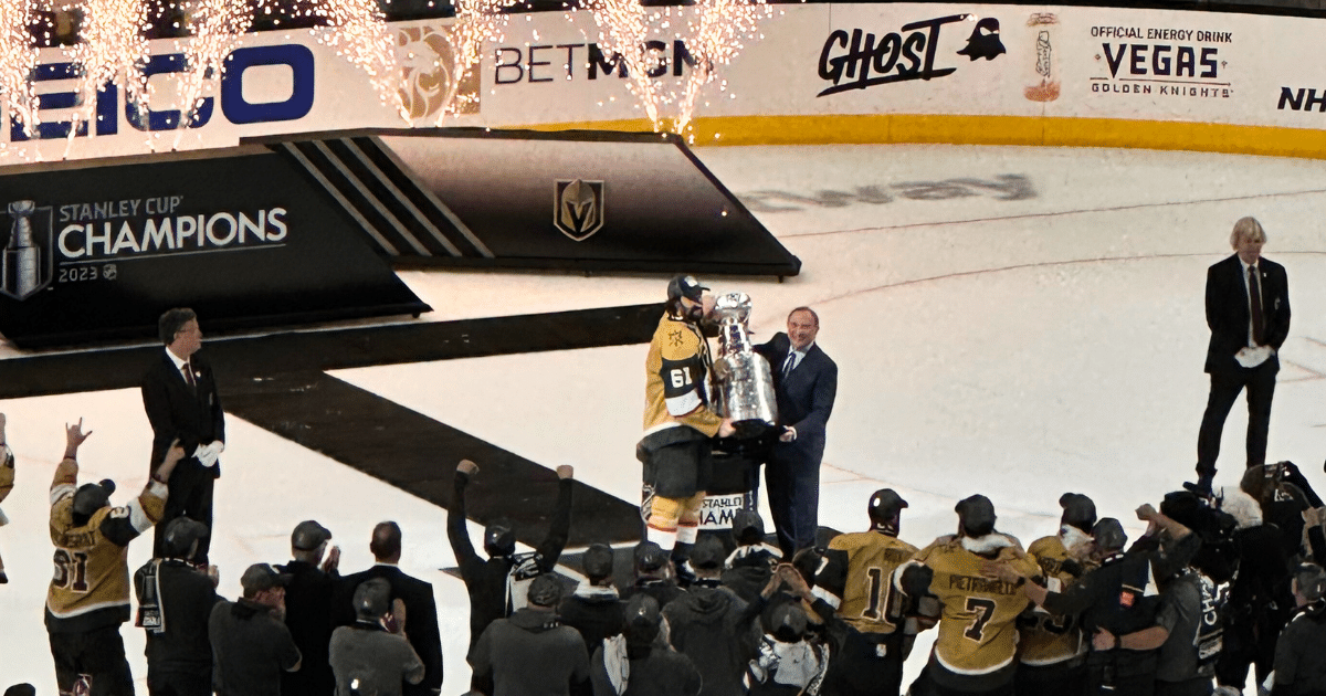 Vegas Golden Knights captain Mark Stone accepts the Stanley Cup from NHL Commissioner Gary Bettman at T-Mobile Arena.